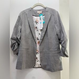 Women’s skies are blue blazer, size small, gray with black and tan